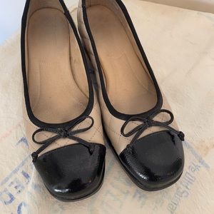 Black and beige flats.